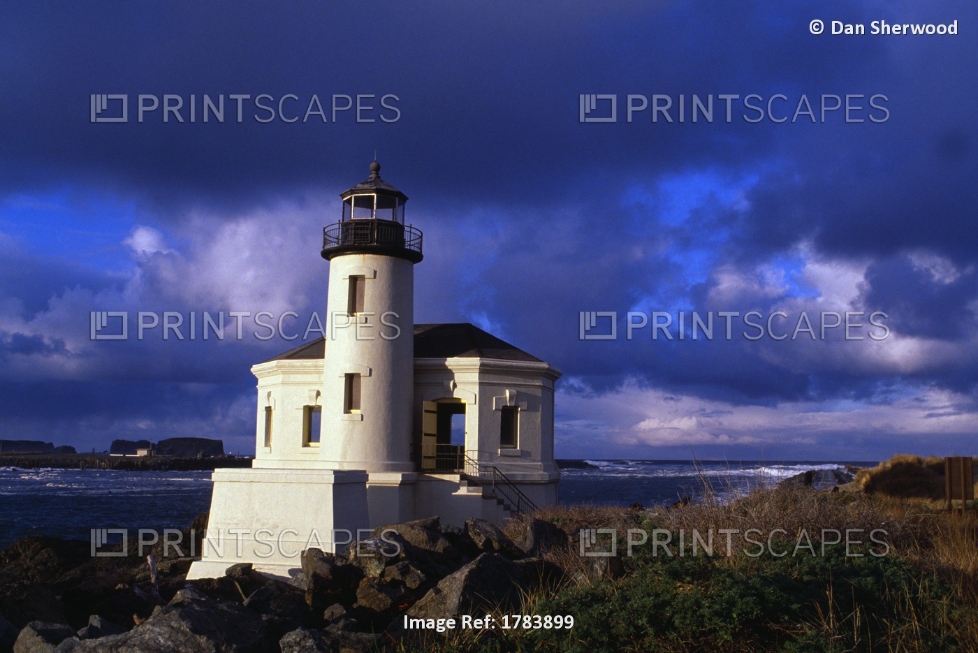 Bandon Lighthouse With Dramatic Light And Clouds