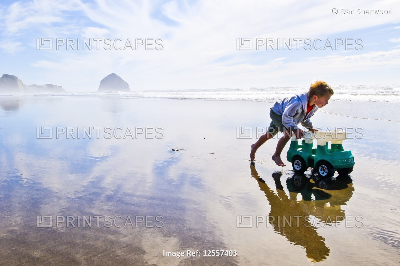 Boy Playing in the wet sand at the Oregon Coast - Oregon